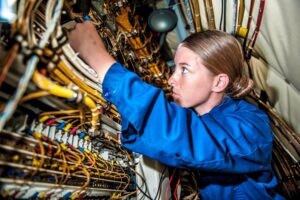 150609-N-MV308-060 KANEOHE BAY, Hawaii (June 9, 2015) Aviation Electrician’s Mate Second Class Morgan Williams, assigned to the “Golden Eagles” of Patrol Squadron (VP) 9, checks the wiring of the main load center on a P-3C Orion maritime patrol aircraft as part of the squadron's advanced readiness program. VP-9 is starting preparations for their inter-deployment readiness cycle, conducting training and maintenance to maximize operational performance readiness and efficiency. (U.S. Navy photo by Mass Communication Specialist 3rd Class Amber Porter/Released)